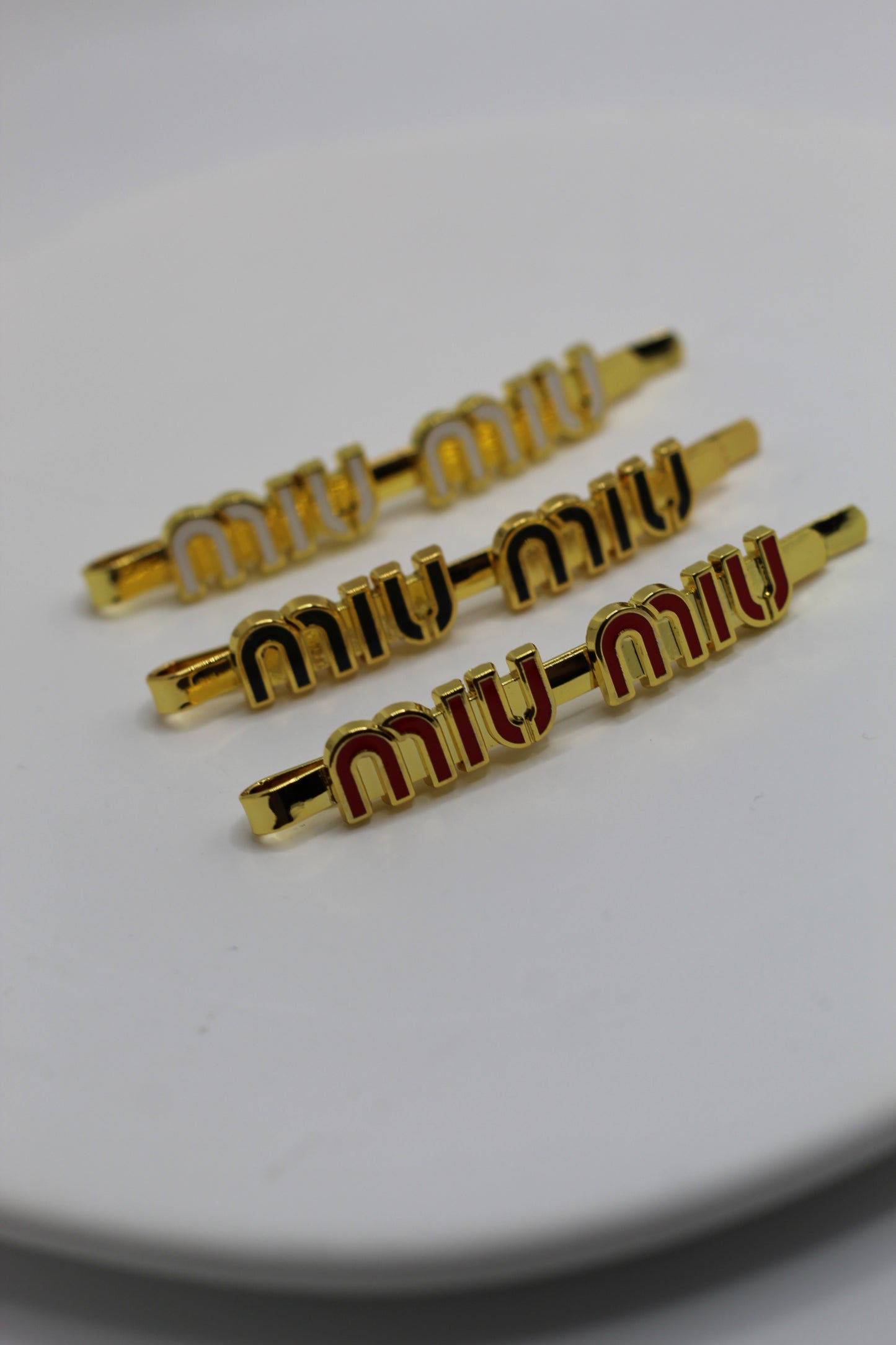 Prendedor Miu M