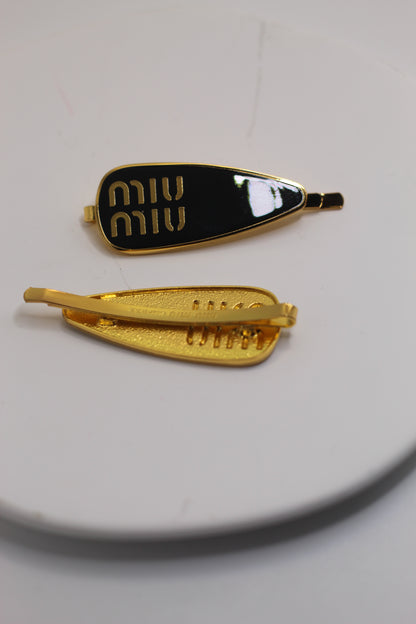 Prendedor Miu M