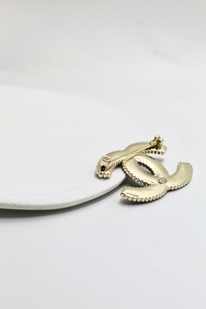 Broche Ch