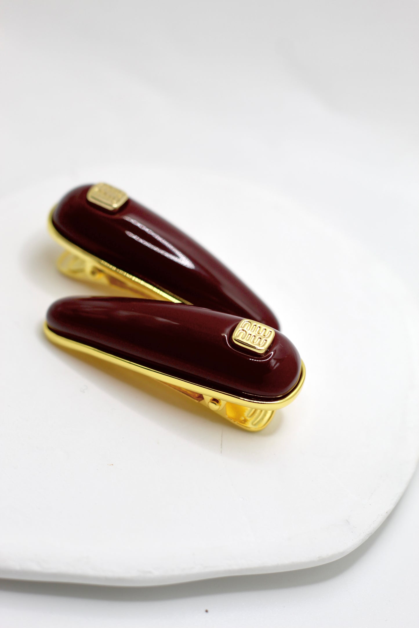 Prendedor Miu M