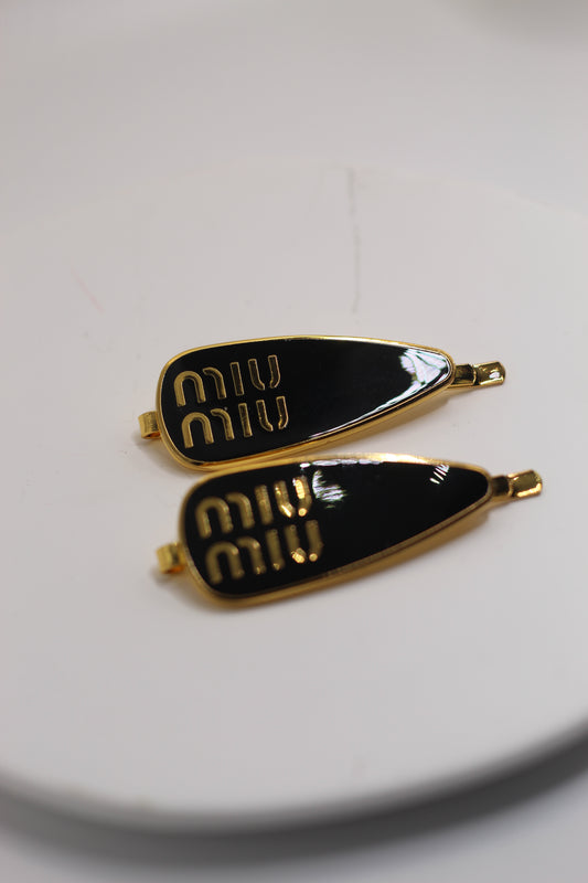 Prendedor Miu M